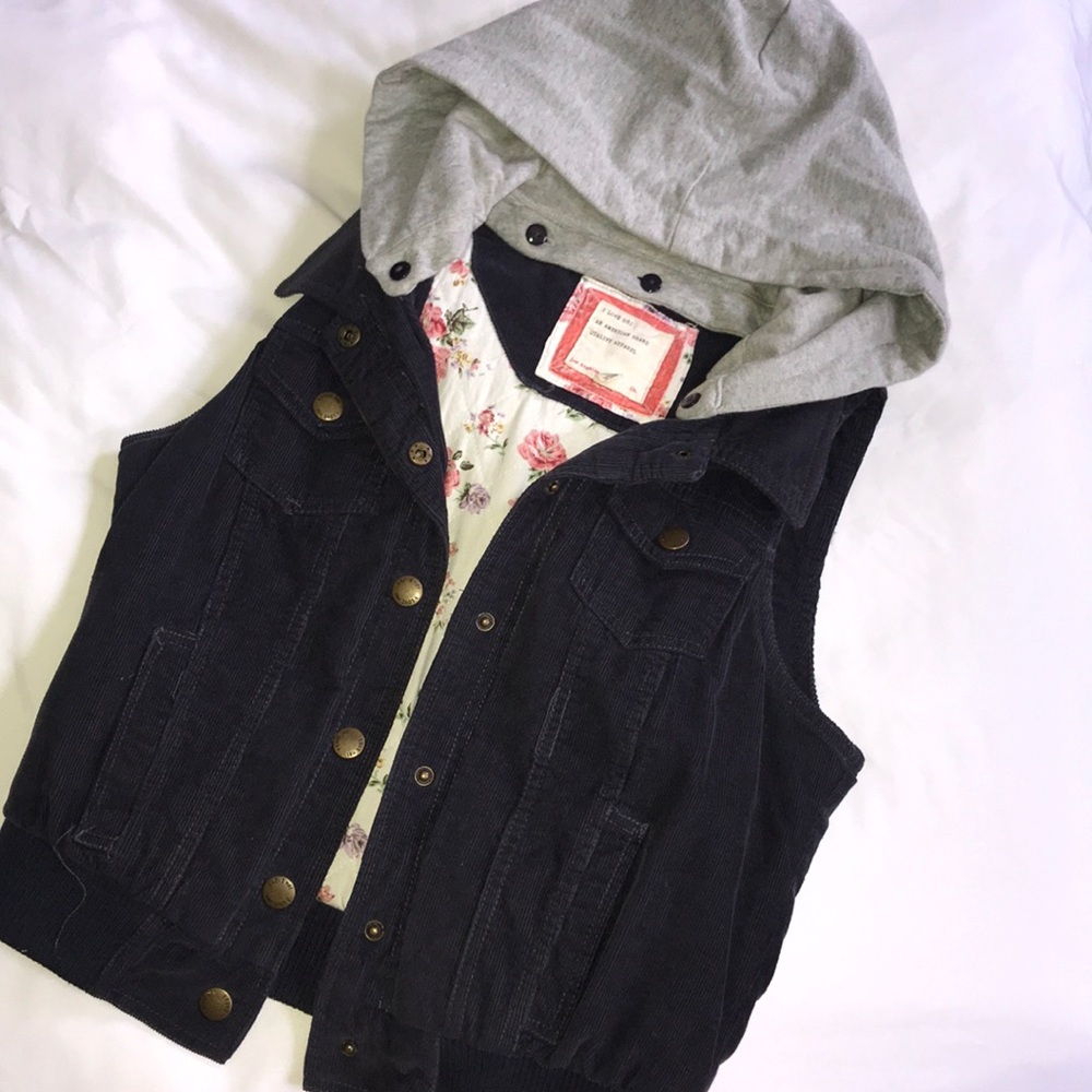 Navy blue corduroy vest with removable grey hood.